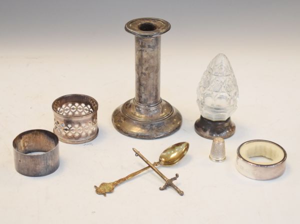 Silver candlestick, cut glass scent bottle with silver cover, napkin rings etc Condition: