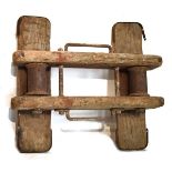 Rustic iron-mounted wooden block of twin platform design with cylindrical mounts Condition: