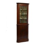 Mahogany and mahogany finish standing corner cabinet, the upper section fitted four shelves enclosed