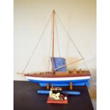 Mid 20th Century pond yacht, 88cm long, together with a small stationary steam engine Condition:
