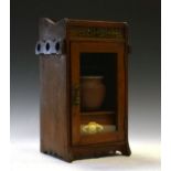 Edwardian oak smokers cabinet fitted two folding racks to the side, the glazed door enclosing a