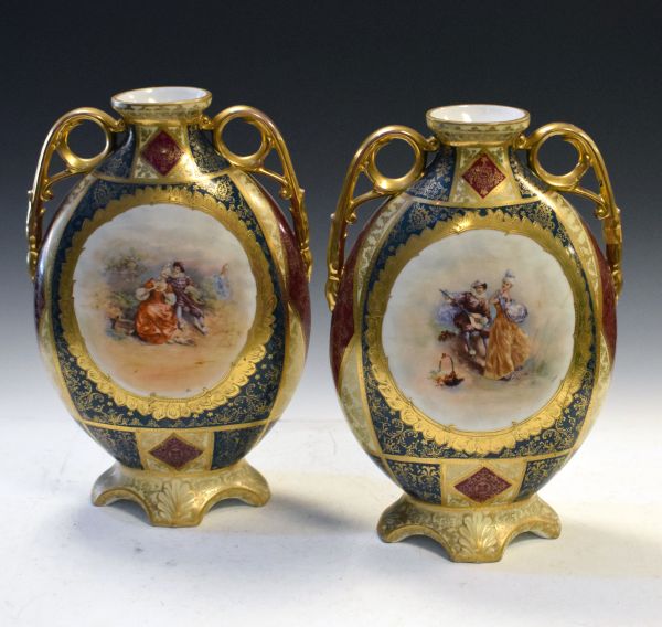 Pair of large late 19th/early 20th Century Continental porcelain oval two handled vases decorated in