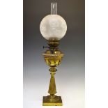 Victorian brass oil lamp standing on a flared reeded pillar and square base, foliate etched glass