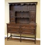 1920's period oak Jacobean Revival high dresser, the plate rack fitted two shelves and two