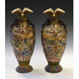 Pair of late 19th/early 20th Century Japanese earthenware baluster shaped vases, each having figural