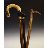 Hiking staff/crook, the carved wooden handle with a mouse motif, a similar staff with a antler