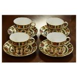 Set of four modern Royal Crown Derby cups and saucers, each decorated with an Imari pattern No.