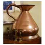 Large copper haystack measure, 34cm high together with four small brass candlesticks Condition: