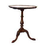 Old reproduction Georgian style mahogany wine table, the circular snap top having a pie-crust