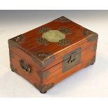 Chinese brass bound hardwood jewellery box, the hinged cover inset with a carved hardstone panel