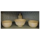 Three modern Wedgwood white on cane jasperware bowls with prunus decoration together with similar