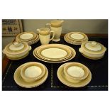 Clarice Cliff dinner service by Wilkinson's, having two-tone brown and green banded decoration on an