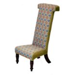 Victorian prie dieu chair upholstered in stylised floral pattern needlepoint and standing on front