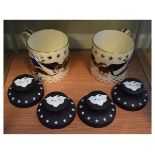 Four Wedgwood white on black basalt jasper American Eagle paperweights, together with two limited