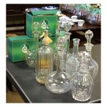 Six Waterford crystal Tramore pattern claret glasses, together with various decanters and a