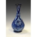 Modern Moorcroft baluster shaped vase decorated in the Florian style with stylised flowers in shades