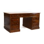 Victorian mahogany double pedestal kneehole desk having an inset leather writing surface and