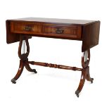 Reproduction mahogany two flap sofa table fitted two real and two dummy drawers and standing on lyre