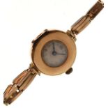 Lady's 15ct gold wristwatch, silvered Arabic dial, flexible bracelet, 24g approx gross Condition: