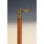 19th Century Malacca walking stick, the cast brass handle formed as the booted leg of a lady