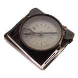 Brass and blackened brass compass clinometer in a leather case Condition: