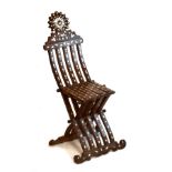 Middle Eastern mother-of-pearl and wire inlaid folding chair in the Savonarola tradition Condition: