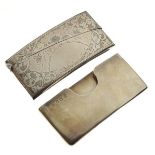 Two early 20th Century silver visiting card cases, the first Edward VII, with engraved decoration,