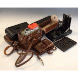 Four vintage folding cameras, a Eumig cine camera and stereoscopic viewer Condition: