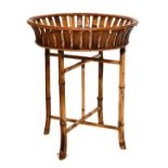 Bamboo and cane work circular basket on folding stand Condition: