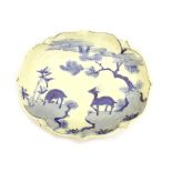 Chinese shaped oval dish having blue and white painted decoration depicting deer in a landscape, the