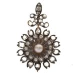 Late Victorian diamond and pearl pendant brooch, of flower head design, the central pearl (