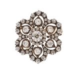 Late Victorian diamond brooch, of hexafoil design, the central old brilliant cut of approximately