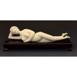 19th Century Chinese carved ivory doctors lady, typically formed as a reclining nude, 21cm long