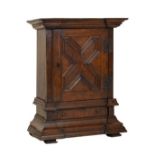 Late 17th Century-style oak table cabinet of inverted breakfront form with geometric moulded door