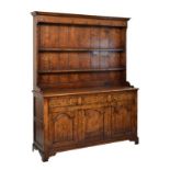 Georgian style oak high dresser by Bylaw of Norfolk, the upper stage with moulded cornice over