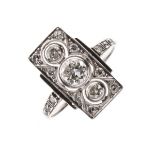 Art Deco diamond panel ring, the white mount unmarked, the three brilliant cuts totalling