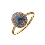 Sapphire and diamond ring, stamped '18ct & Plat', the cabochon measuring approximately 6.7mm x 4.6mm