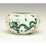 Chinese circular bowl having painted decoration depicting dragons chasing a flaming pearl in green