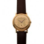 Movado - '18k' cased bumper self-winding wristwatch, the signed gold dial with raised hour