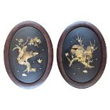 Pair of Japanese lacquer, mother-of-pearl and bone oval panels, Meiji period, each decorated with an