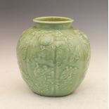 Chinese celadon glazed lobed ovoid vase decorated in relief with butterflies amongst fruiting