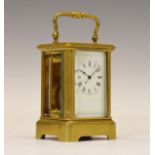 Early 20th Century brass cased 'mignonette' carriage timepiece, having a white Roman dial and single