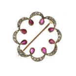 Edwardian rose diamond and ruby circlet brooch, unmarked, the arched circle with inner points of