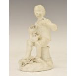 Early 19th Century Rockingham biscuit figure, circa 1825, depicting a boy seated on an upturned
