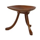 Liberty & Co 'Thebes' stool having a dished D-shape seat on three splayed supports, 36cm wide x 34cm