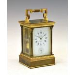 Brass cased carriage clock, the white enamel dial with Roman and Arabic numerals and subsidiary