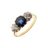 Sapphire and diamond three stone ring, indistinct mark, the cushion shaped sapphire measuring