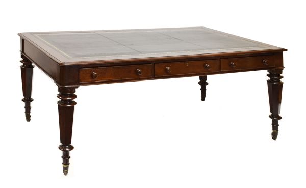 Late 19th/early 20th Century mahogany library table, the moulded rectangular top with gilt-tooled