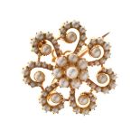 Late Victorian split pearl pendant/brooch, unmarked, the central cluster with seven spiralling arms,