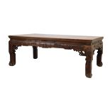 Late 19th/early 20th Century Chinese hardwood low or 'opium' table, the rectangular top above carved